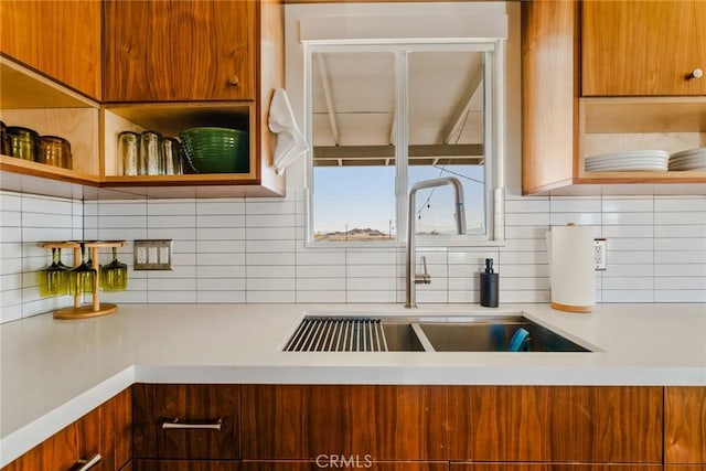 79124 Valle Vista Rd Unit 29, Palms, CA 92277 - kitchen featuring a sink, light countertops, tasteful backsplash, and open shelves