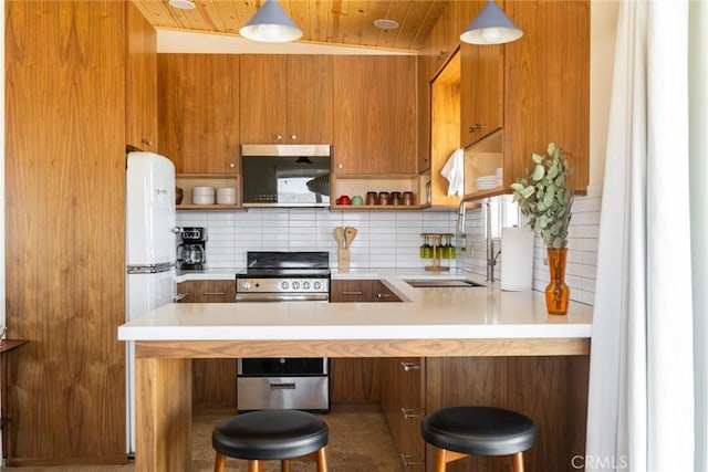 79124 Valle Vista Rd Unit 29, Palms, CA 92277 - kitchen with open shelves, a sink, stainless steel range, backsplash, and light countertops