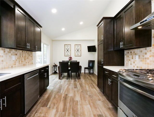 4784 Browndeer Ln, Rancho Palos Verdes, CA 90275 - kitchen with stainless steel appliances, range hood, light countertops, lofted ceiling, and light wood-type flooring