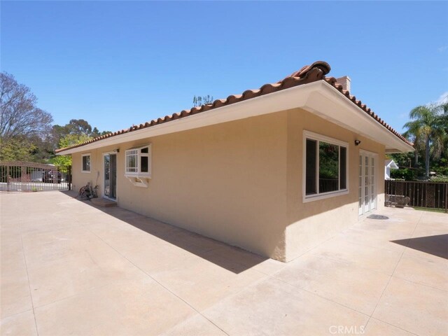 4784 Browndeer Ln, Rancho Palos Verdes, CA 90275 - back of house with stucco siding, a patio, a tiled roof, and french doors
