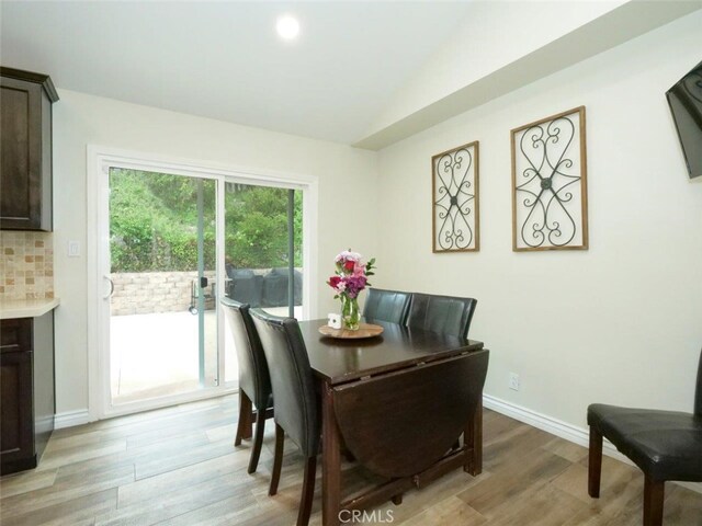 4784 Browndeer Ln, Rancho Palos Verdes, CA 90275 - dining area featuring light wood-style floors, lofted ceiling, and baseboards