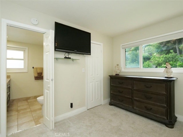 4784 Browndeer Ln, Rancho Palos Verdes, CA 90275 - bedroom featuring multiple windows, connected bathroom, baseboards, and light colored carpet