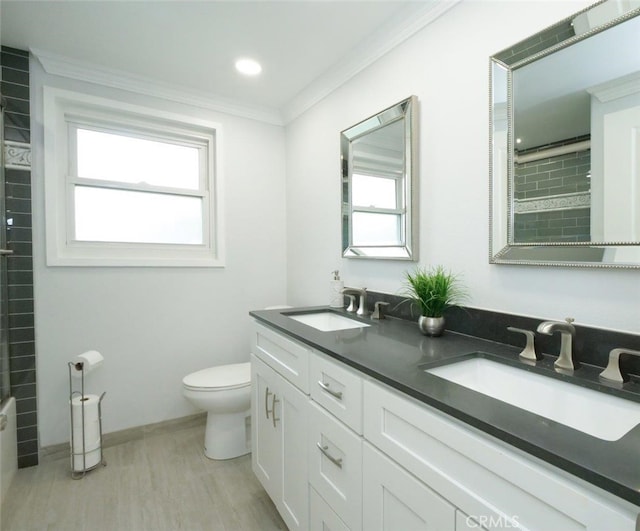 4784 Browndeer Ln, Rancho Palos Verdes, CA 90275 - bathroom with ornamental molding, toilet, double vanity, healthy amount of natural light, and wood finished floors