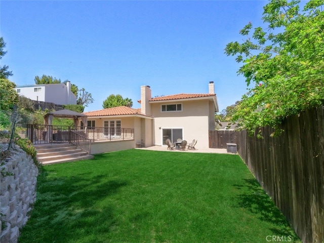 4784 Browndeer Ln, Rancho Palos Verdes, CA 90275 - back of house featuring a gazebo, a chimney, stucco siding, a tiled roof, and a patio