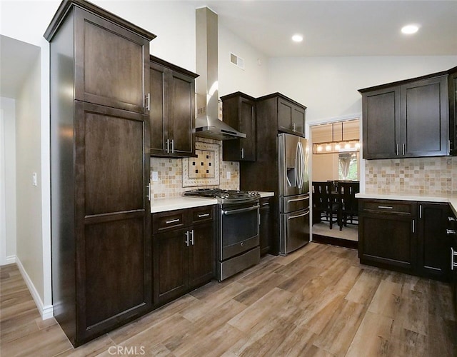 4784 Browndeer Ln, Rancho Palos Verdes, CA 90275 - kitchen featuring stainless steel appliances, tasteful backsplash, light wood-style flooring, dark brown cabinets, and lofted ceiling