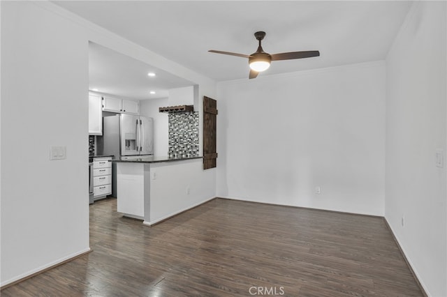 23478 Cambridge Rd Unit 296, Yorba Linda, CA 92887 - kitchen with stainless steel refrigerator with ice dispenser, dark countertops, a peninsula, a ceiling fan, and white cabinets