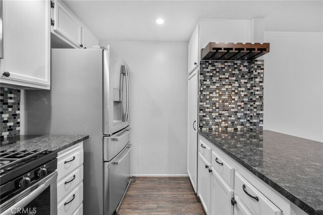 23478 Cambridge Rd Unit 296, Yorba Linda, CA 92887 - kitchen featuring decorative backsplash, white cabinets, dark wood finished floors, dark stone counters, and recessed lighting