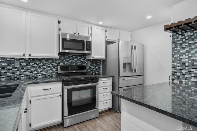 23478 Cambridge Rd Unit 296, Yorba Linda, CA 92887 - kitchen featuring stainless steel appliances, white cabinetry, decorative backsplash, and recessed lighting