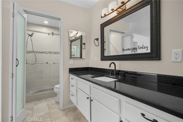 23478 Cambridge Rd Unit 296, Yorba Linda, CA 92887 - bathroom with toilet, a stall shower, vanity, tile patterned flooring, and baseboards