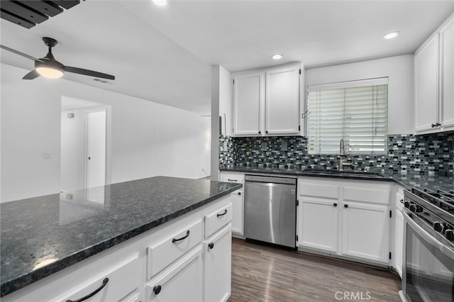 23478 Cambridge Rd Unit 296, Yorba Linda, CA 92887 - kitchen with stainless steel appliances, a sink, white cabinetry, decorative backsplash, and recessed lighting