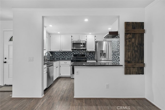 23478 Cambridge Rd Unit 296, Yorba Linda, CA 92887 - kitchen with appliances with stainless steel finishes, a sink, white cabinetry, decorative backsplash, and dark wood-style floors