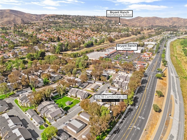 23478 Cambridge Rd Unit 296, Yorba Linda, CA 92887 - aerial view of property and surrounding area with nearby suburban area, a major roadway, and mountains