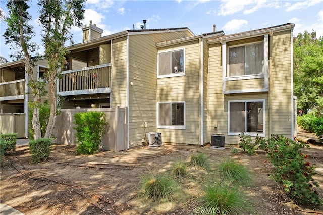23478 Cambridge Rd Unit 296, Yorba Linda, CA 92887 - rear view of property with a chimney