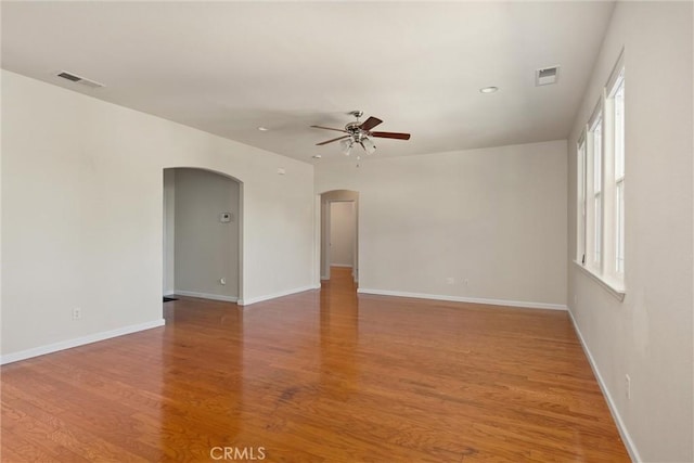 1095 Glenwood Ln, Willows, CA 95988 - spare room with arched walkways, ceiling fan, plenty of natural light, light wood-type flooring, and recessed lighting