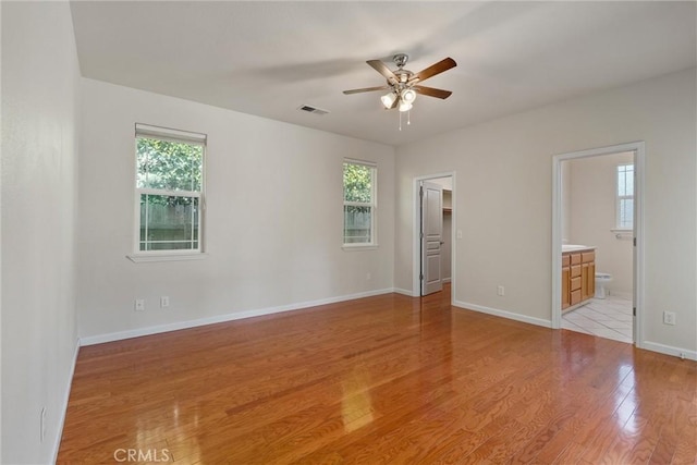 1095 Glenwood Ln, Willows, CA 95988 - empty room with a ceiling fan, plenty of natural light, light wood-type flooring, and baseboards