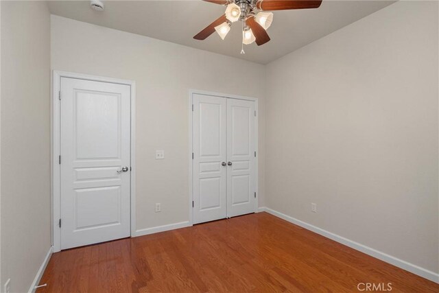 1095 Glenwood Ln, Willows, CA 95988 - unfurnished bedroom featuring baseboards, wood finished floors, and ceiling fan