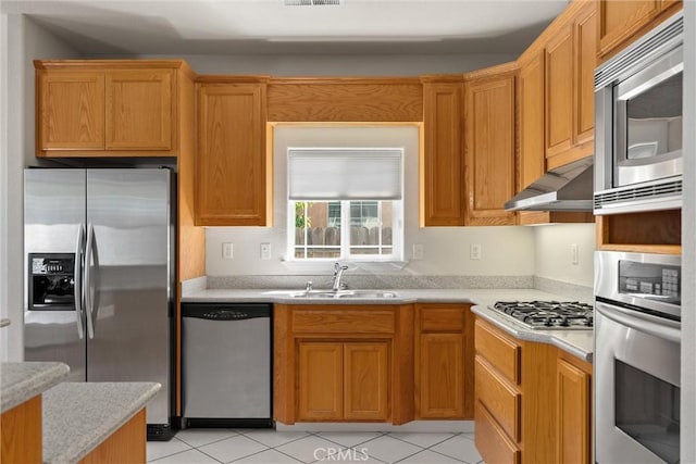 1095 Glenwood Ln, Willows, CA 95988 - kitchen with appliances with stainless steel finishes, a sink, light countertops, and extractor fan