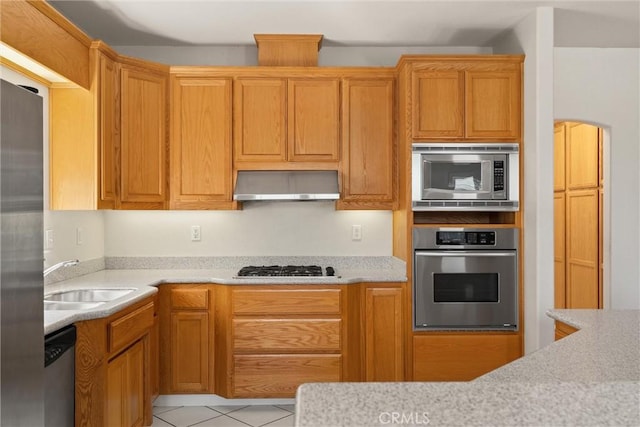 1095 Glenwood Ln, Willows, CA 95988 - kitchen with stainless steel appliances, ventilation hood, a sink, and light countertops