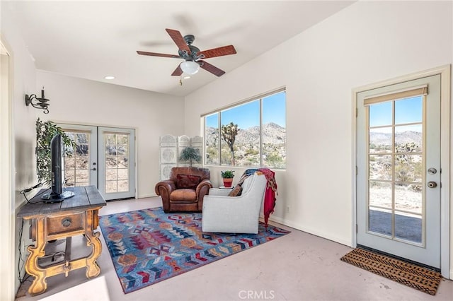 8830 Quail Springs Rd, Joshua Tree, CA 92252 - living area with finished concrete floors, healthy amount of natural light, french doors, and a ceiling fan