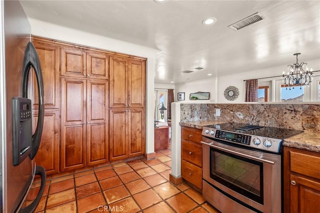 8830 Quail Springs Rd, Joshua Tree, CA 92252 - kitchen featuring stainless steel appliances, brown cabinets, plenty of natural light, and recessed lighting