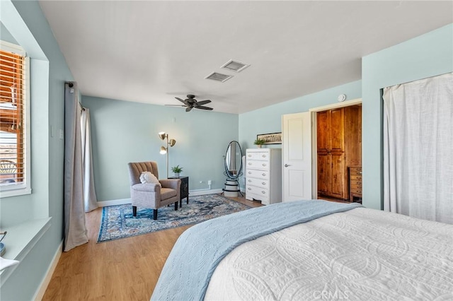 8830 Quail Springs Rd, Joshua Tree, CA 92252 - bedroom with light wood-style floors, baseboards, and ceiling fan