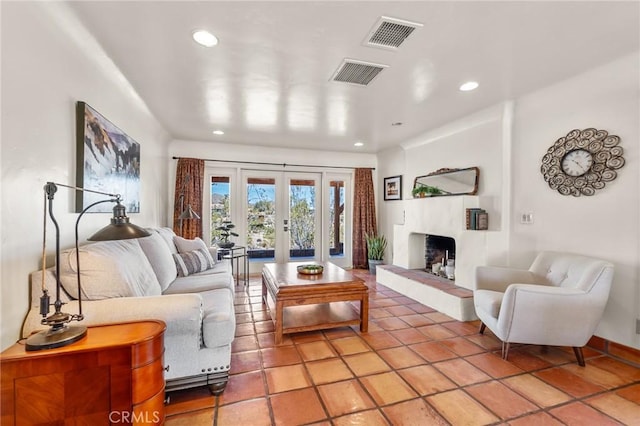 8830 Quail Springs Rd, Joshua Tree, CA 92252 - living room with recessed lighting, a fireplace, french doors, and baseboards