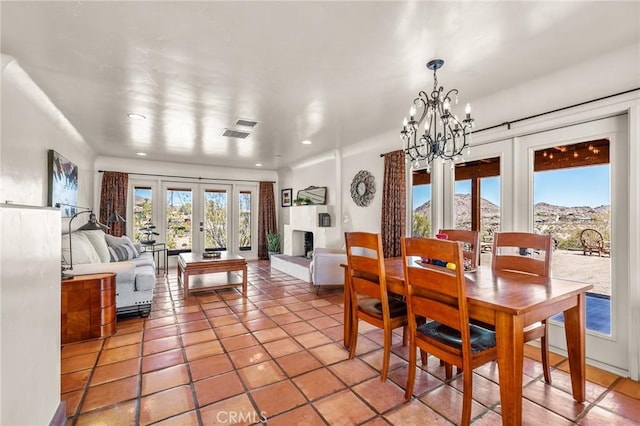 8830 Quail Springs Rd, Joshua Tree, CA 92252 - dining area with recessed lighting, a chandelier, light tile patterned flooring, and french doors