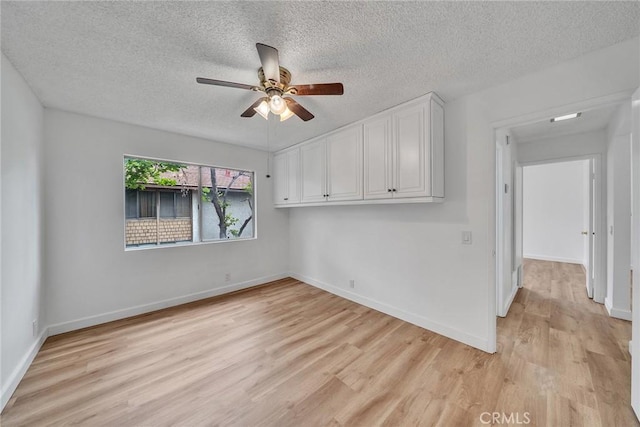 901 Golden Springs Dr Unit D13, Diamond Bar, CA 91765 - unfurnished room with a ceiling fan, light wood-type flooring, a textured ceiling, and baseboards