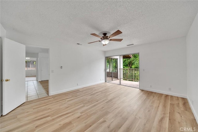 901 Golden Springs Dr Unit D13, Diamond Bar, CA 91765 - empty room with light wood finished floors, a ceiling fan, a textured ceiling, and baseboards
