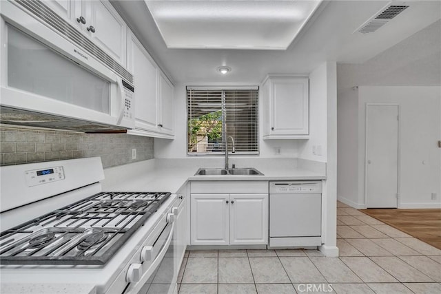 901 Golden Springs Dr Unit D13, Diamond Bar, CA 91765 - kitchen featuring white appliances, a sink, white cabinets, light tile patterned floors, and light countertops