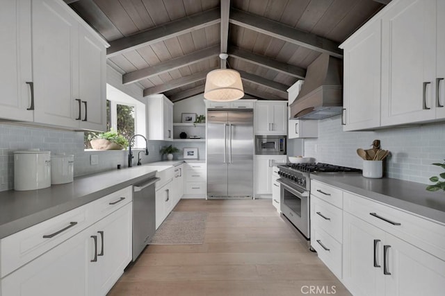 10 Camel Pt, Laguna Beach, CA 92651 - kitchen featuring built in appliances, decorative backsplash, open shelves, a sink, and light wood finished floors