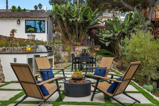 10 Camel Pt, Laguna Beach, CA 92651 - view of patio / terrace with an outdoor kitchen, a fire pit, and a sink