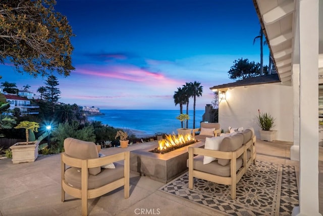 10 Camel Pt, Laguna Beach, CA 92651 - view of patio / terrace featuring a fire pit and a water view
