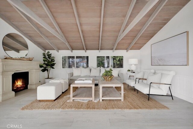 10 Camel Pt, Laguna Beach, CA 92651 - living room featuring wood ceiling, a warm lit fireplace, and wood finished floors