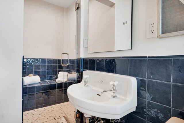 10 Camel Pt, Laguna Beach, CA 92651 - bathroom with tile walls, a sink, and a wainscoted wall