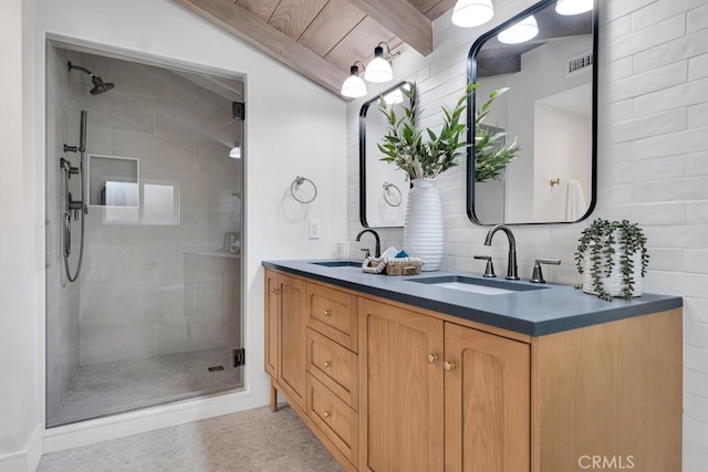 10 Camel Pt, Laguna Beach, CA 92651 - bathroom featuring a stall shower, double vanity, and beam ceiling