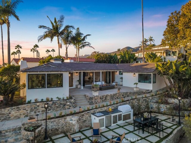 10 Camel Pt, Laguna Beach, CA 92651 - back of property with a patio, exterior kitchen, and stucco siding