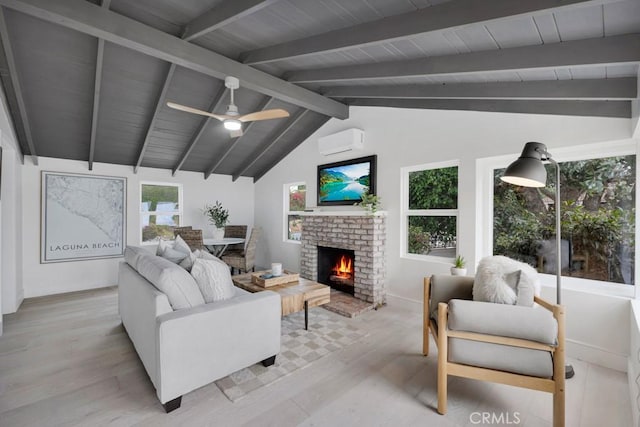 10 Camel Pt, Laguna Beach, CA 92651 - living area with wood finished floors, baseboards, a ceiling fan, a brick fireplace, and a wall mounted air conditioner