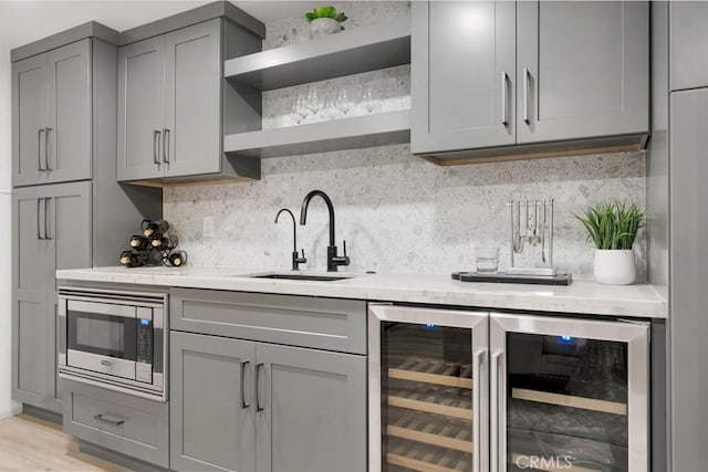 10 Camel Pt, Laguna Beach, CA 92651 - indoor bar featuring stainless steel microwave, decorative backsplash, and wine cooler