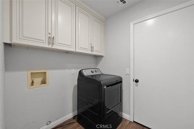 8225 W W Ave E4, Lancaster, CA 93536 - laundry room with washer / clothes dryer, cabinet space, wood finished floors, and baseboards