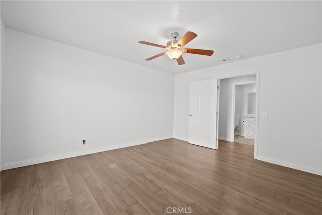 8225 W W Ave E4, Lancaster, CA 93536 - spare room featuring a ceiling fan, wood finished floors, and baseboards