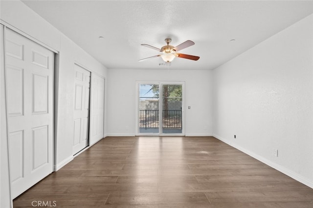 8225 W W Ave E4, Lancaster, CA 93536 - unfurnished bedroom with access to exterior, wood finished floors, and baseboards