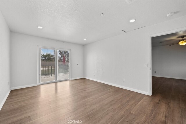 8225 W W Ave E4, Lancaster, CA 93536 - empty room featuring wood finished floors, recessed lighting, ceiling fan, baseboards, and a smoke detector