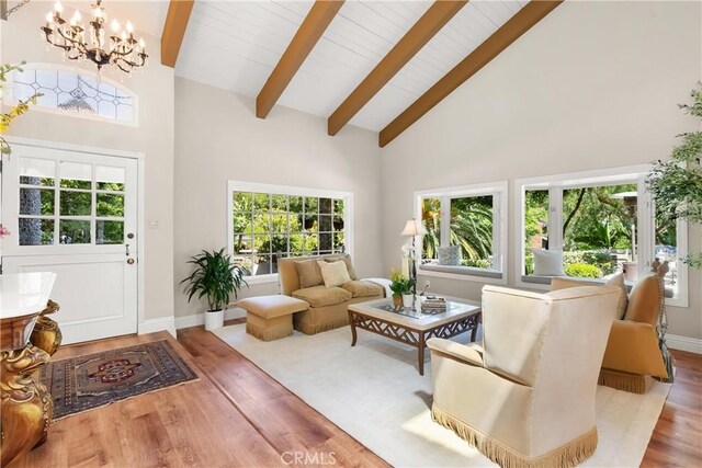 1761 Lemon Ter, North Tustin, CA 92705 - living area featuring a chandelier, beamed ceiling, high vaulted ceiling, wood finished floors, and plenty of natural light