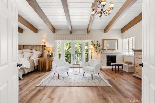 1761 Lemon Ter, North Tustin, CA 92705 - bedroom with a chandelier, beam ceiling, a brick fireplace, and wood finished floors