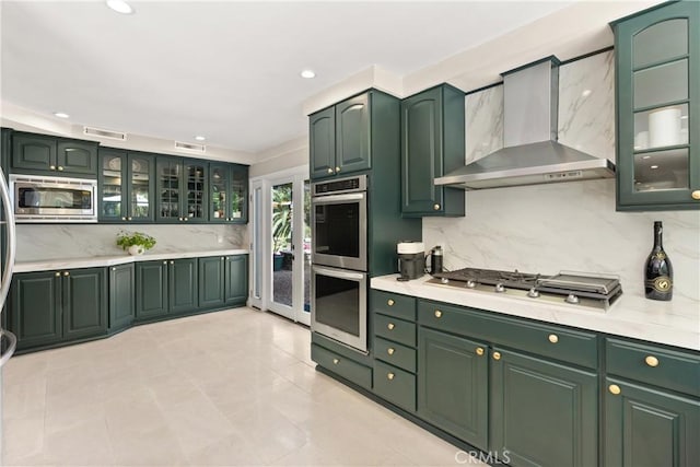 1761 Lemon Ter, North Tustin, CA 92705 - kitchen featuring wall chimney exhaust hood, stainless steel appliances, green cabinetry, and recessed lighting