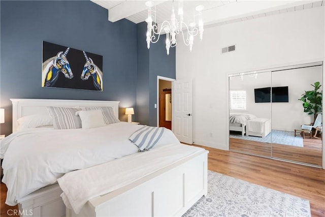 1761 Lemon Ter, North Tustin, CA 92705 - bedroom with a chandelier, light wood-style floors, high vaulted ceiling, wood ceiling with exposed beams, and baseboards