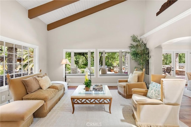 1761 Lemon Ter, North Tustin, CA 92705 - living area featuring arched walkways, high vaulted ceiling, wood finished floors, beam ceiling, and baseboards