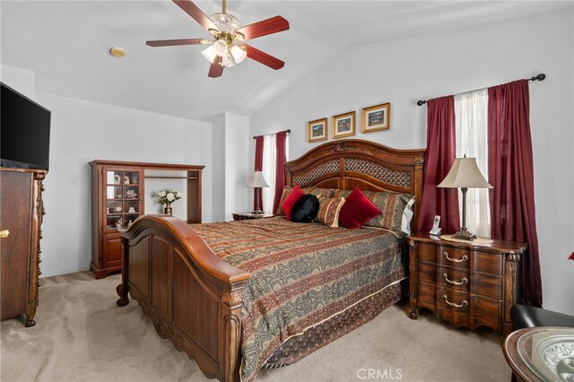 16290 Via Ultimo, Moreno Valley, CA 92551 - bedroom featuring light carpet, lofted ceiling, and a ceiling fan