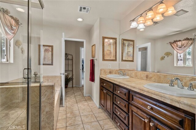 16290 Via Ultimo, Moreno Valley, CA 92551 - bathroom featuring double vanity, tile patterned floors, and a shower stall